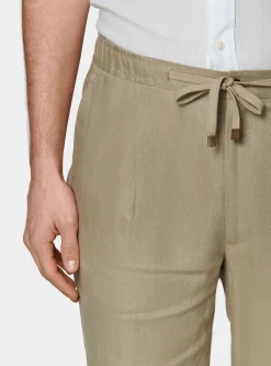 Pantaloni in puro lino con pince e coulisse